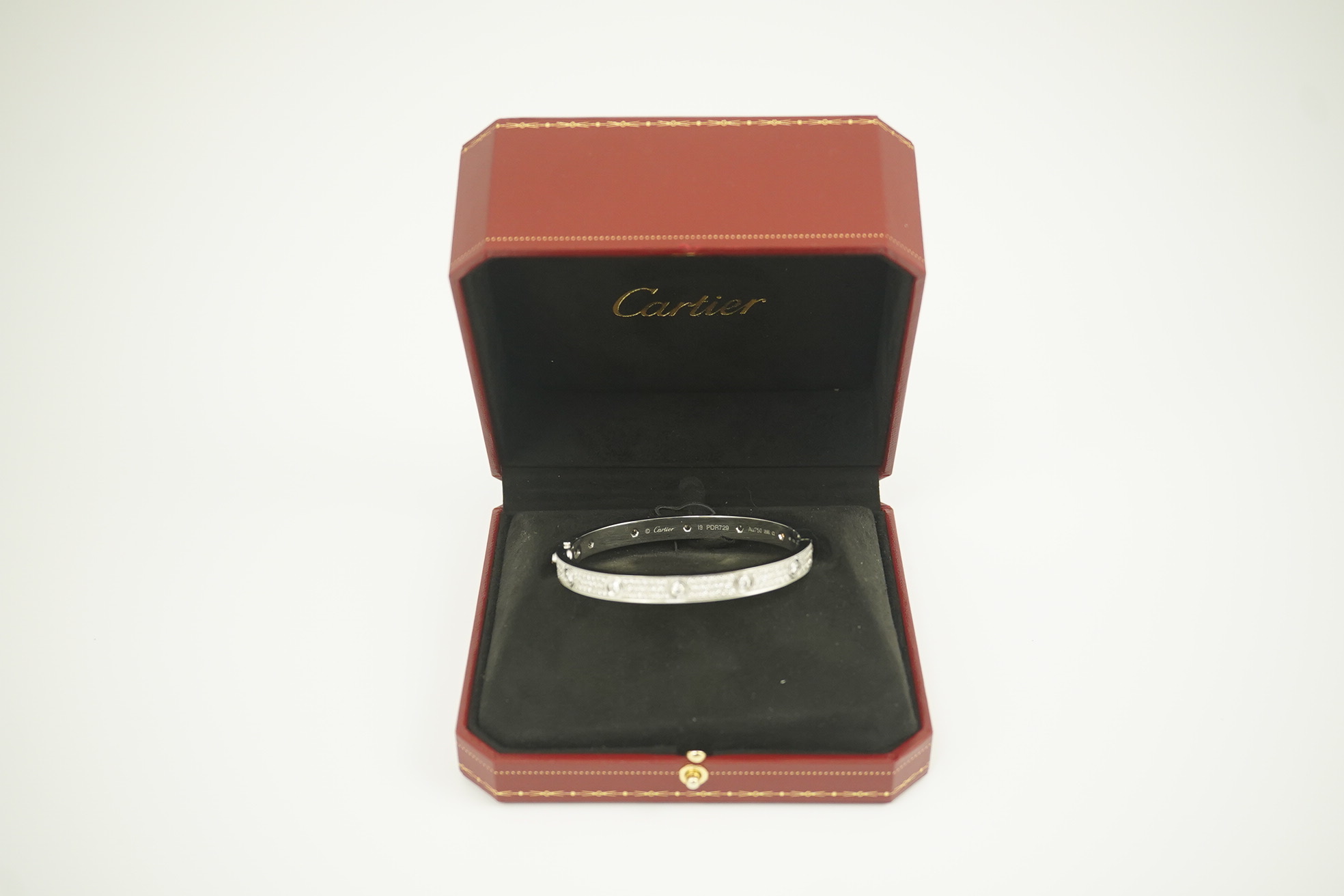 A modern Cartier 18k white gold and diamond cluster set hinged 'Love' bangle